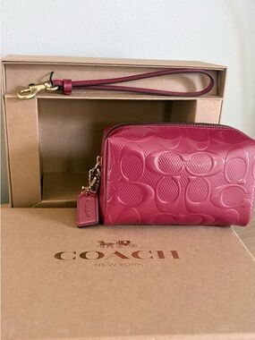 Coach Pink Signature Embossed Wristlet Cosmetic Bag